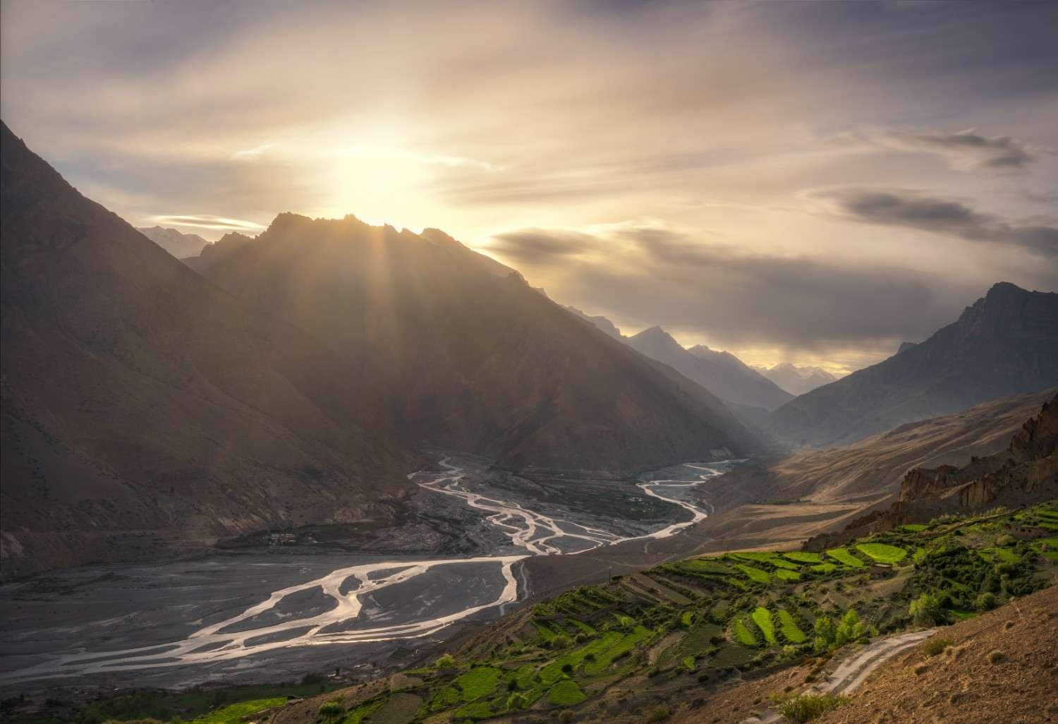 Sunlight breaking across the Spiti valley